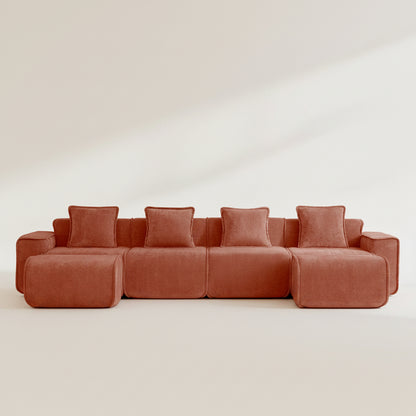 studio shot of the seneca boneless couch four seater with two ottomans in terracotta velvet