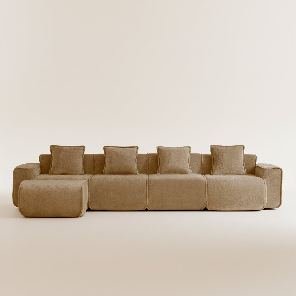 studio shot of the seneca boneless couch with four seats and one ottoman in mocha