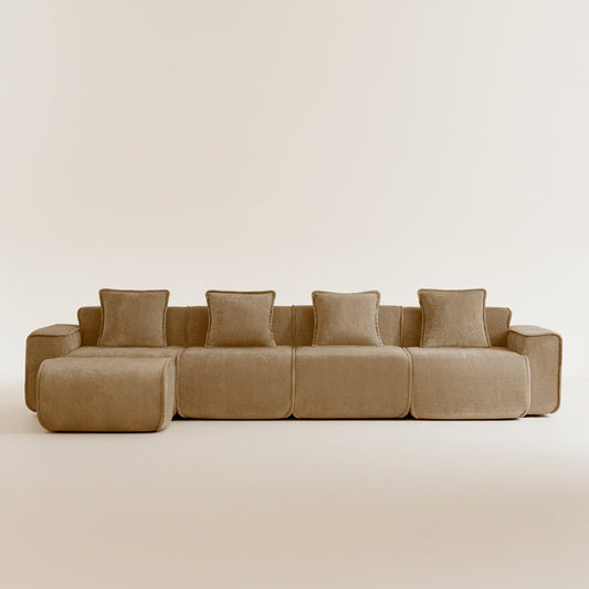 studio shot of the seneca boneless couch with four seats and one ottoman in mocha