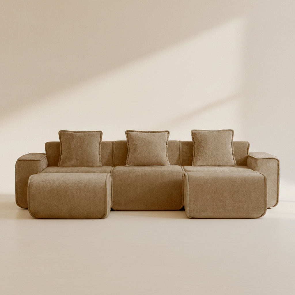 studio shot of the seneca boneless couch in mocha velvet showing three seats and two ottomans
