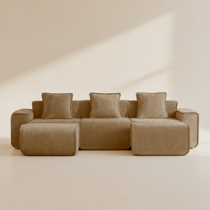 studio shot of the seneca boneless couch in mocha velvet showing three seats and two ottomans