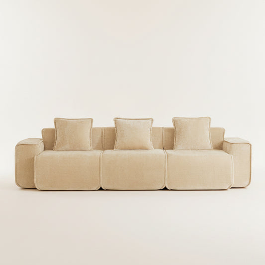 studio shot of the seneca boneless couch in camel with three seats