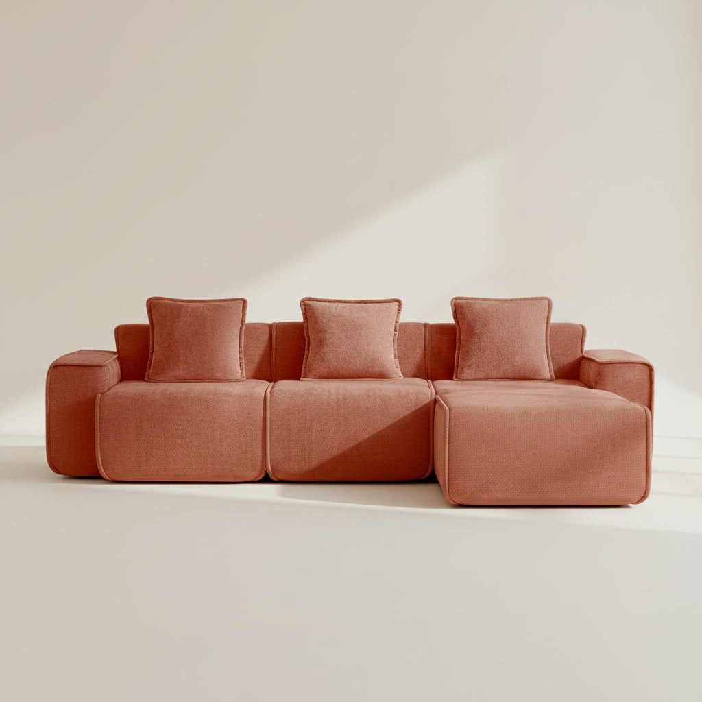 studio shot of the seneca boneless couch with three seats and one ottoman in terracotta
