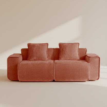 studio shot of the seneca boneless couch two seater in terracotta velvet