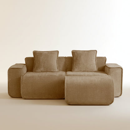 studio shot of the seneca boneless couch with ottoman in mocha