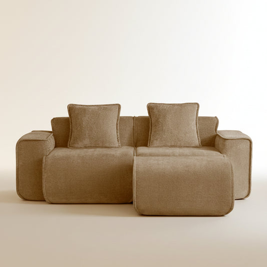 studio shot of the seneca boneless couch with ottoman in mocha