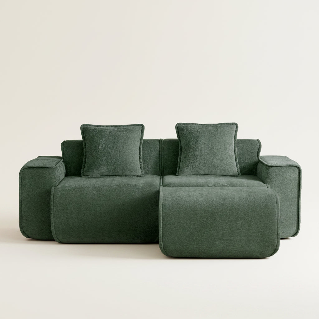 studio shot of the seneca boneless couch showing its lush olive velvet upholstery two seats and one ottoman
